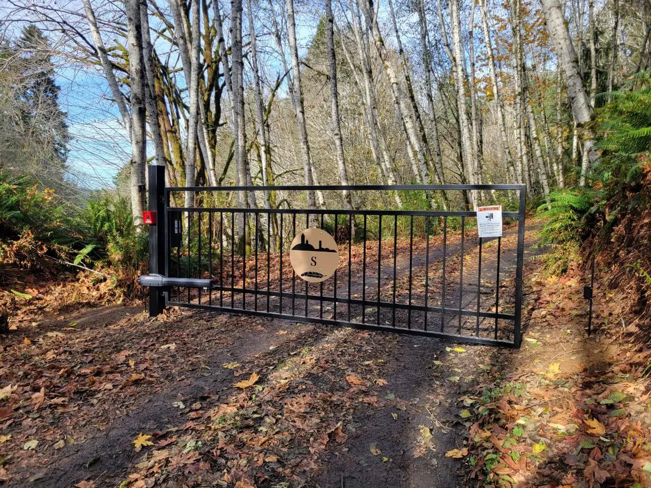 Custom automated driveway gate installed at a Western Washington property entrance
