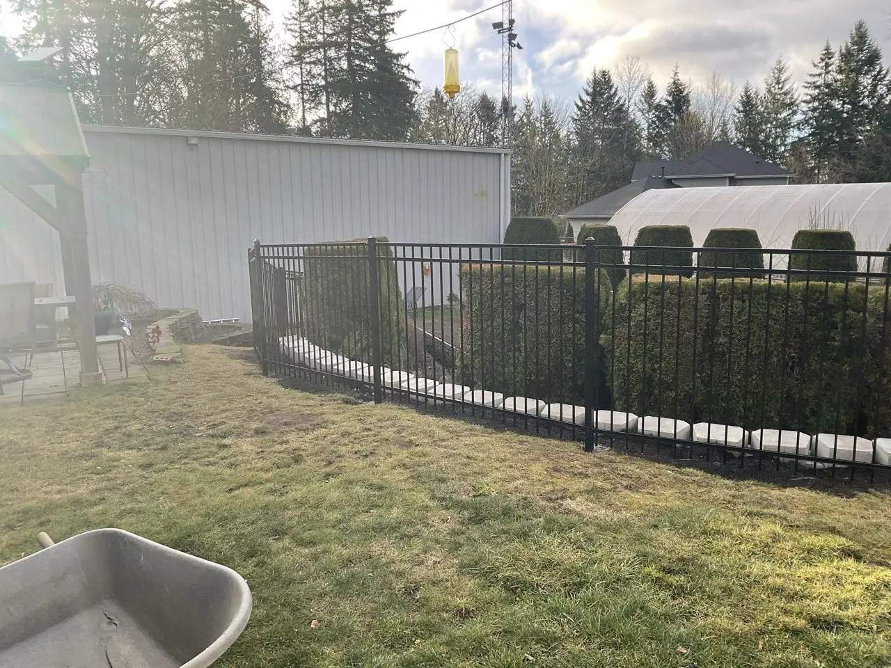Five-foot black ornamental iron fence installed at a Western Washington residence